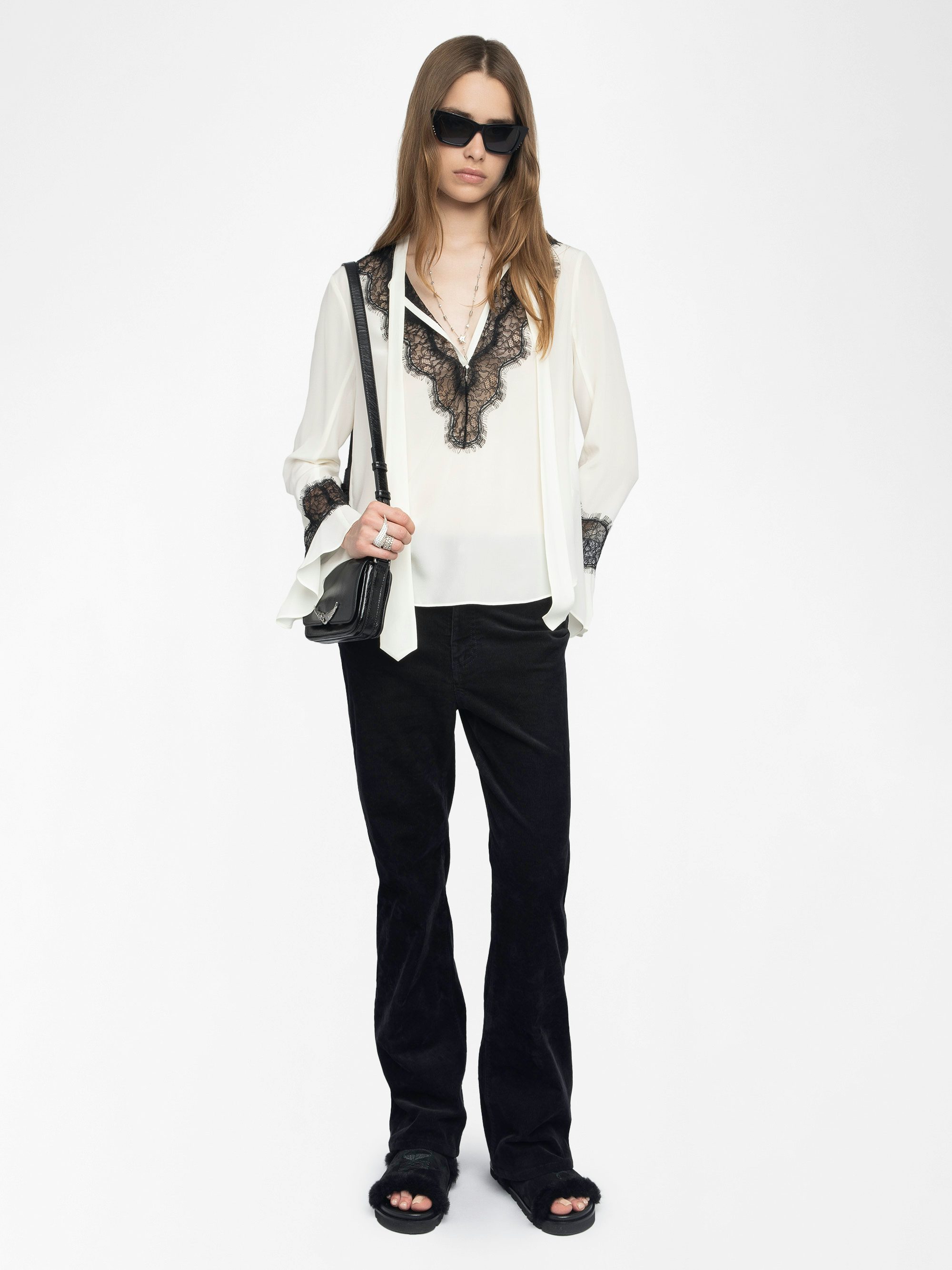 Tuan Lace Shirt - The Tuan shirt plays contrast with a soft ivory silk and bold black lace trim. Effortlessly sensual, it drapes with attitude—open neckline, flared cuffs, and just the right amount of rebellion.